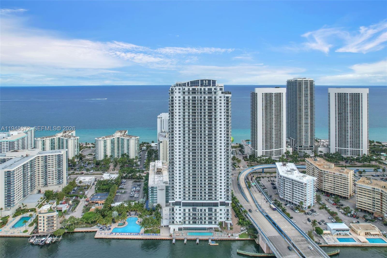 4010 South Ocean Drive, Unit R701 Hollywood, FL 33019 - Photo 2 of 46 a city view with tall buildings