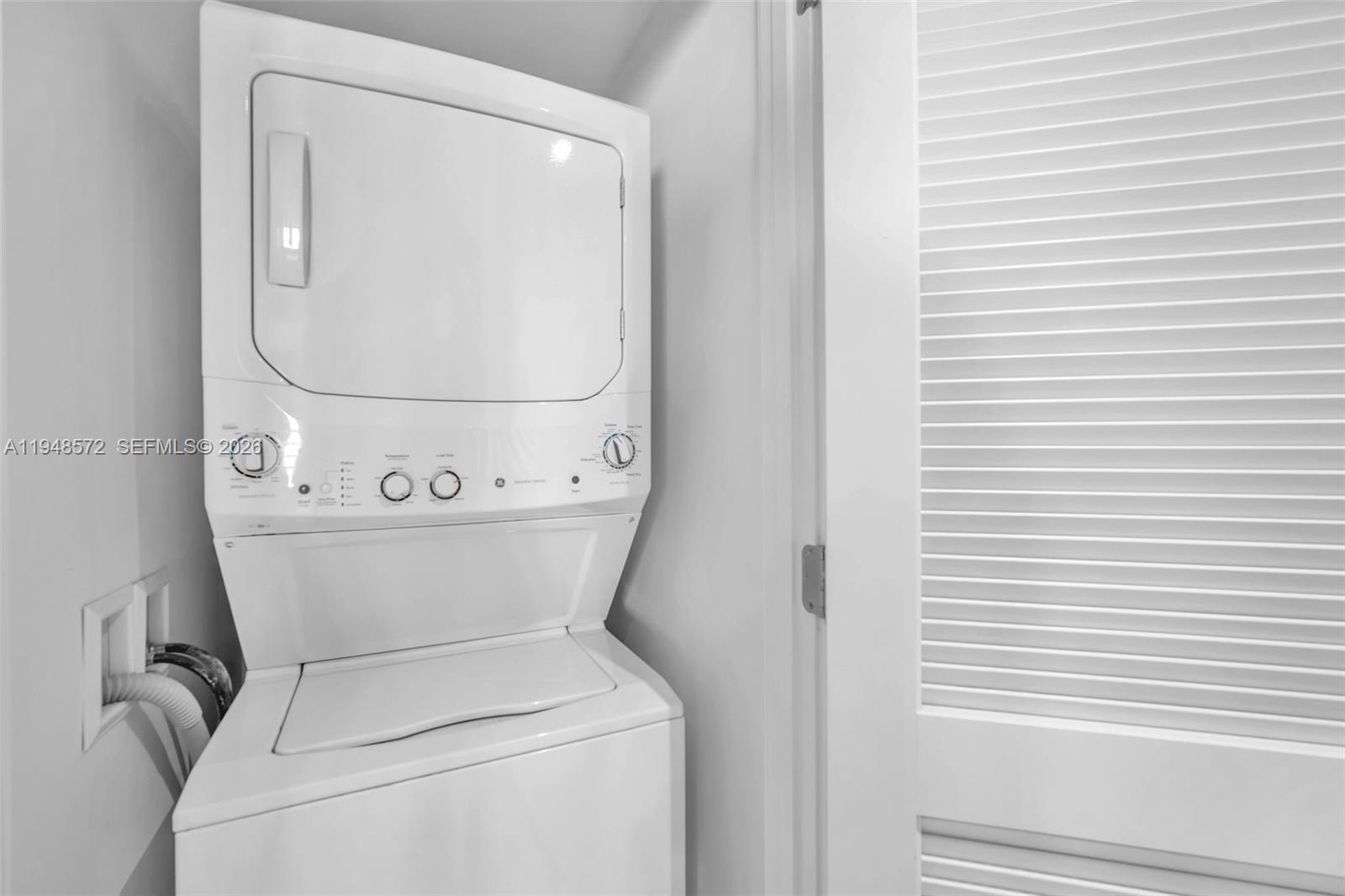 4010 South Ocean Drive, Unit R701 Hollywood, FL 33019 - Photo 23 of 46 a utility room with dryer and washer