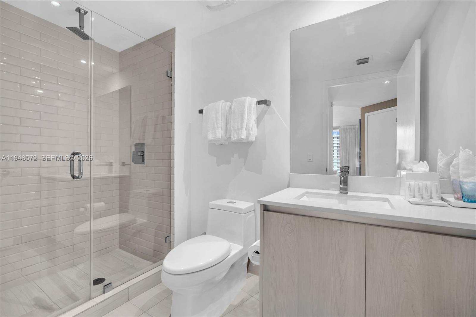 4010 South Ocean Drive, Unit R701 Hollywood, FL 33019 - Photo 24 of 46 a bathroom with a sink toilet and shower
