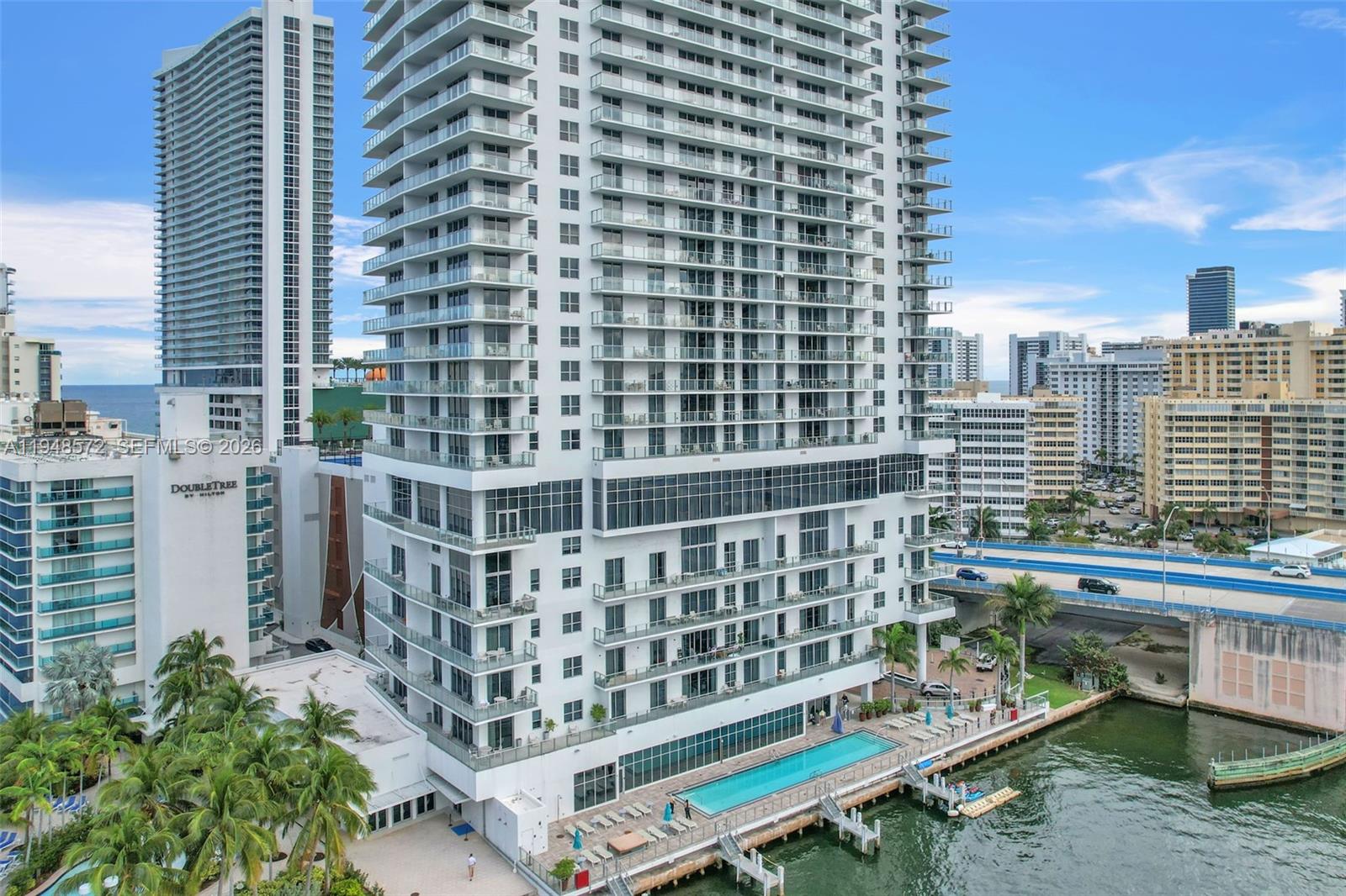 4010 South Ocean Drive, Unit R701 Hollywood, FL 33019 - Photo 3 of 46 a view of a balcony with a bench