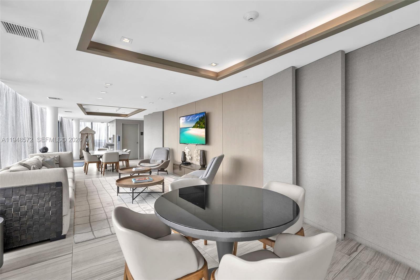 4010 South Ocean Drive, Unit R701 Hollywood, FL 33019 - Photo 33 of 46 a dining room with furniture a rug and a window