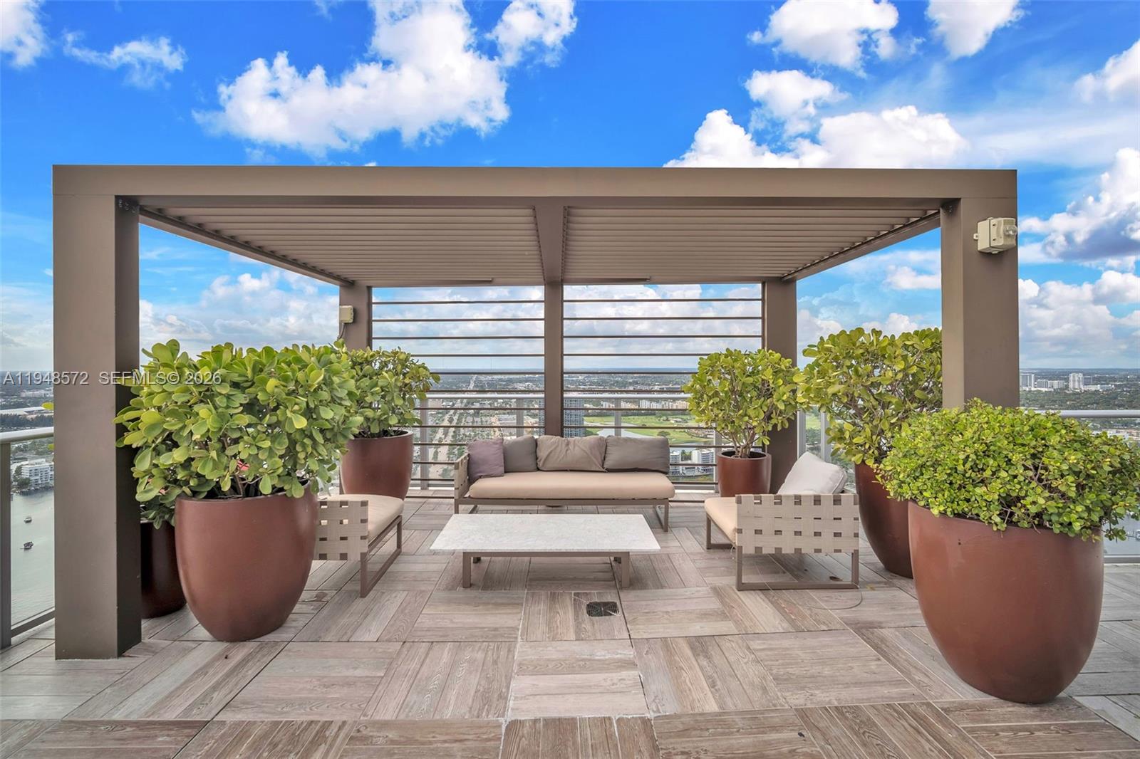 4010 South Ocean Drive, Unit R701 Hollywood, FL 33019 - Photo 35 of 46 a view of a entryway with flower pots