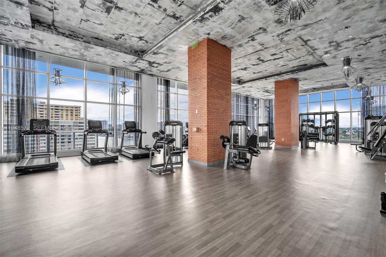 4010 South Ocean Drive, Unit R701 Hollywood, FL 33019 - Photo 39 of 46 a lobby with furniture and floor to ceiling window