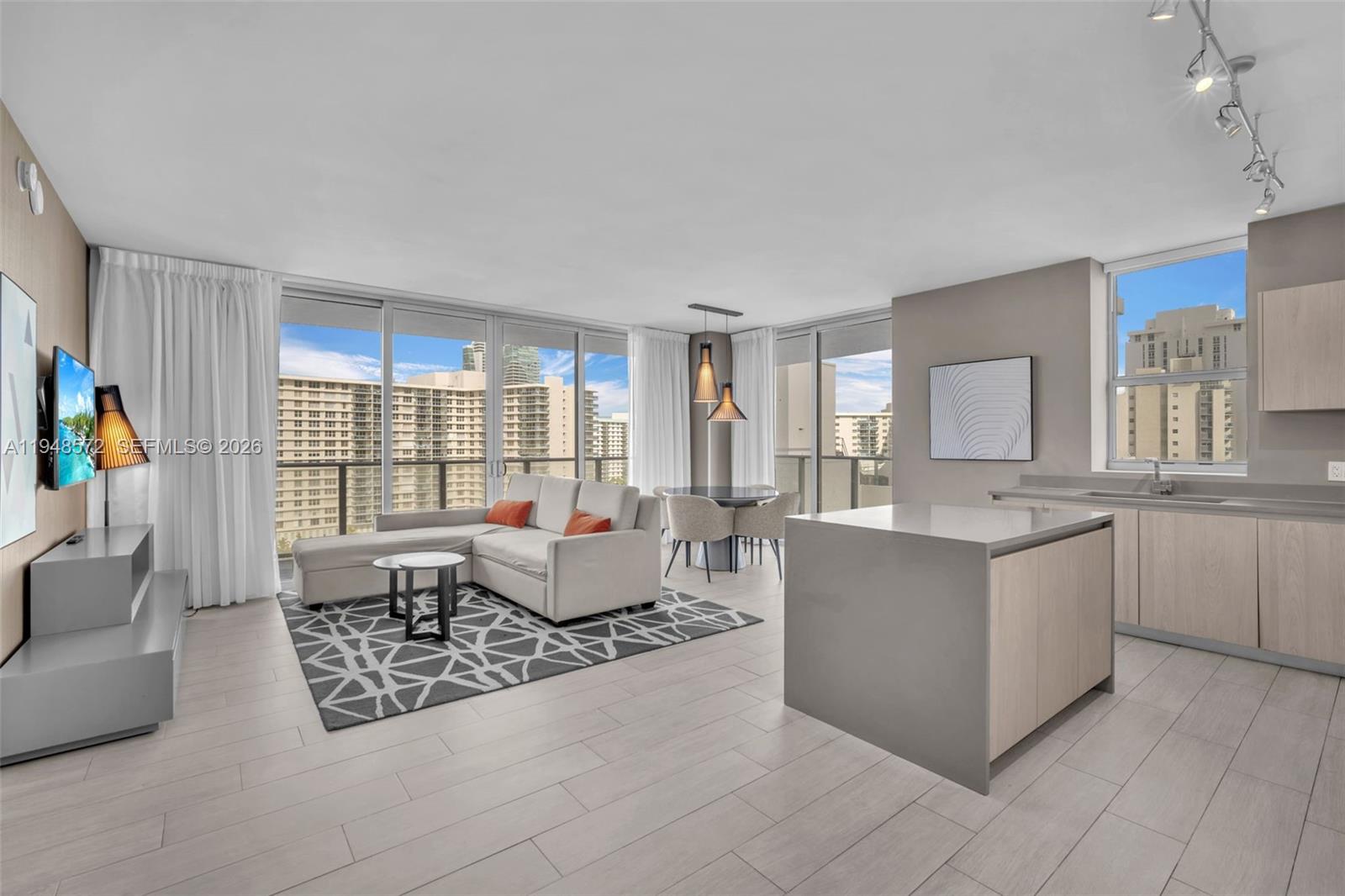 4010 South Ocean Drive, Unit R701 Hollywood, FL 33019 - Photo 6 of 46 a living room with furniture and a window