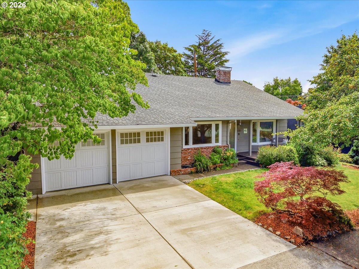 3130 Southwest 116th Avenue Beaverton, OR 97005 - Photo 2 of 44 a front view of house with yard and trees around