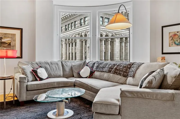 a living room with furniture and a table