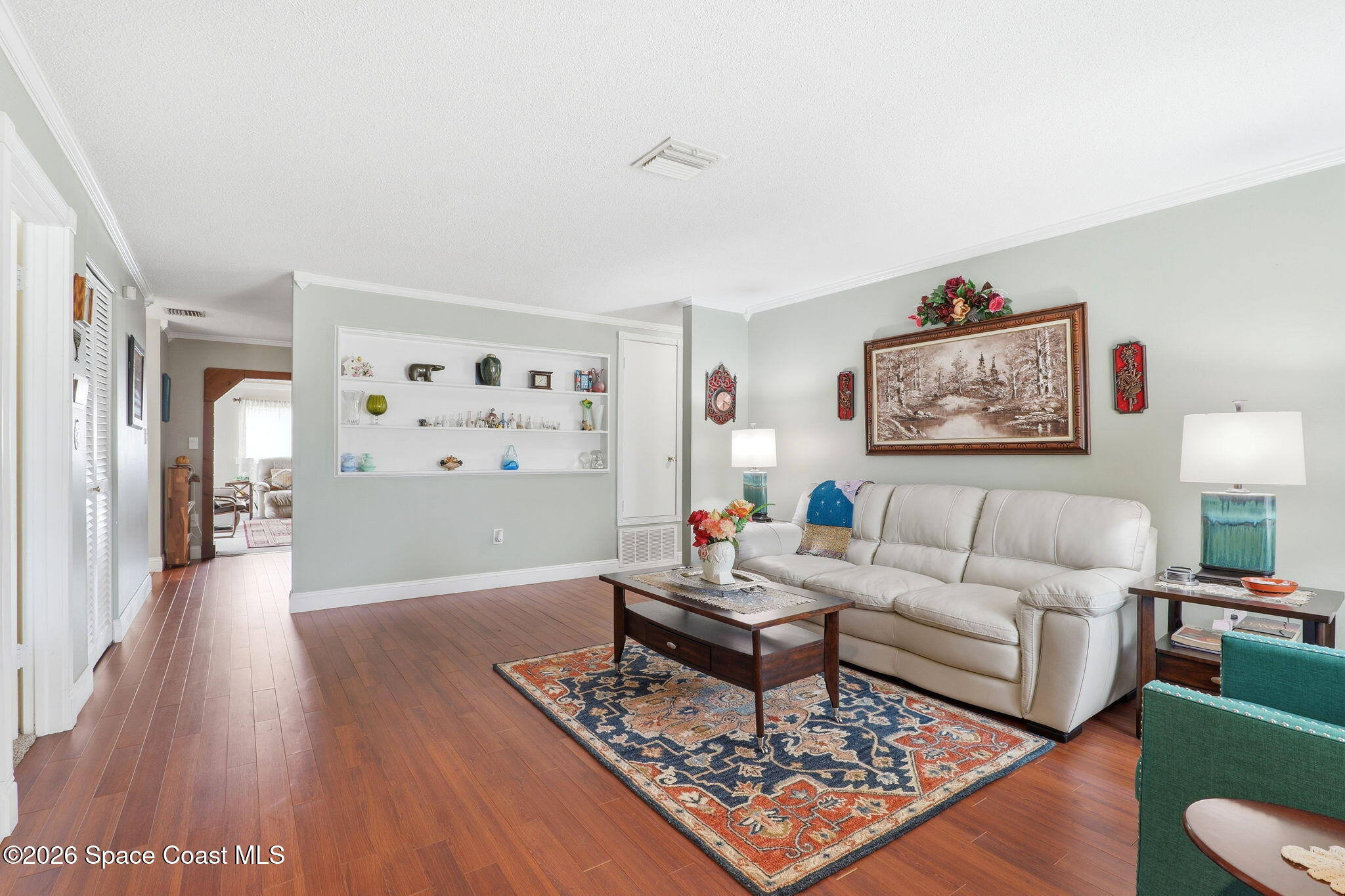 908 Jefferson Road Rockledge, FL 32955 - Photo 2 of 37 a living room with furniture a lamp and a window