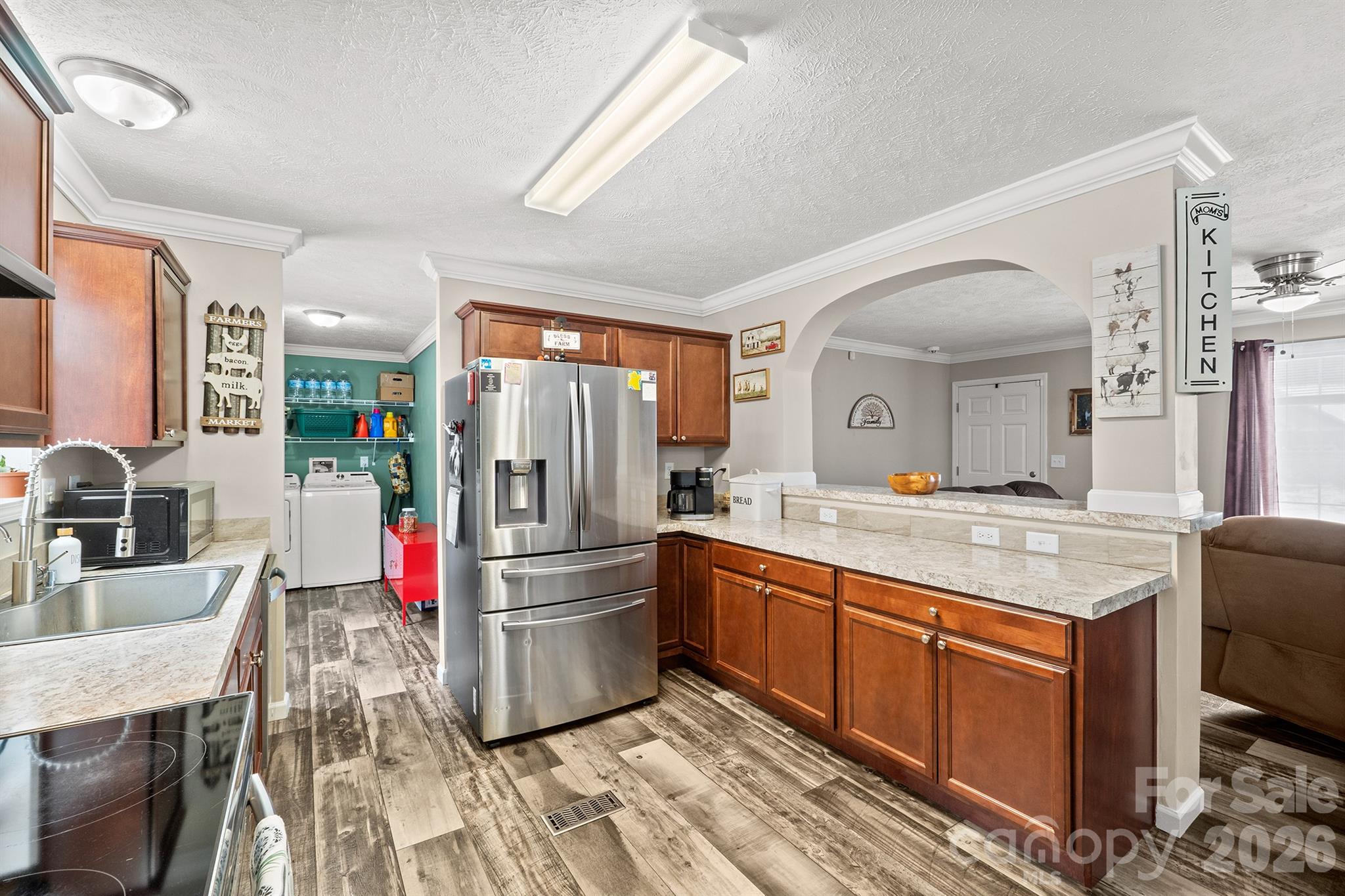 119 Marietta Road Mooresville, NC 28117 - Photo 12 of 38 a kitchen with granite countertop a refrigerator stove top oven and sink
