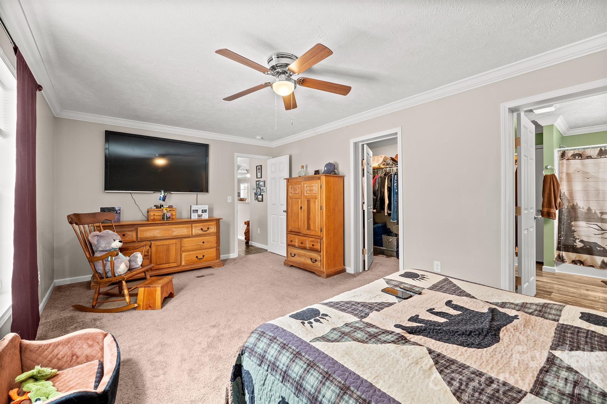 119 Marietta Road Mooresville, NC 28117 - Photo 23 of 38 a bedroom with a bed and a flat screen tv