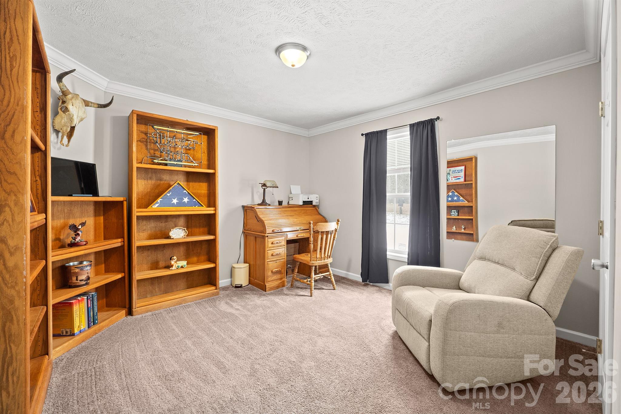 119 Marietta Road Mooresville, NC 28117 - Photo 26 of 38 a bedroom with furniture and a book shelf