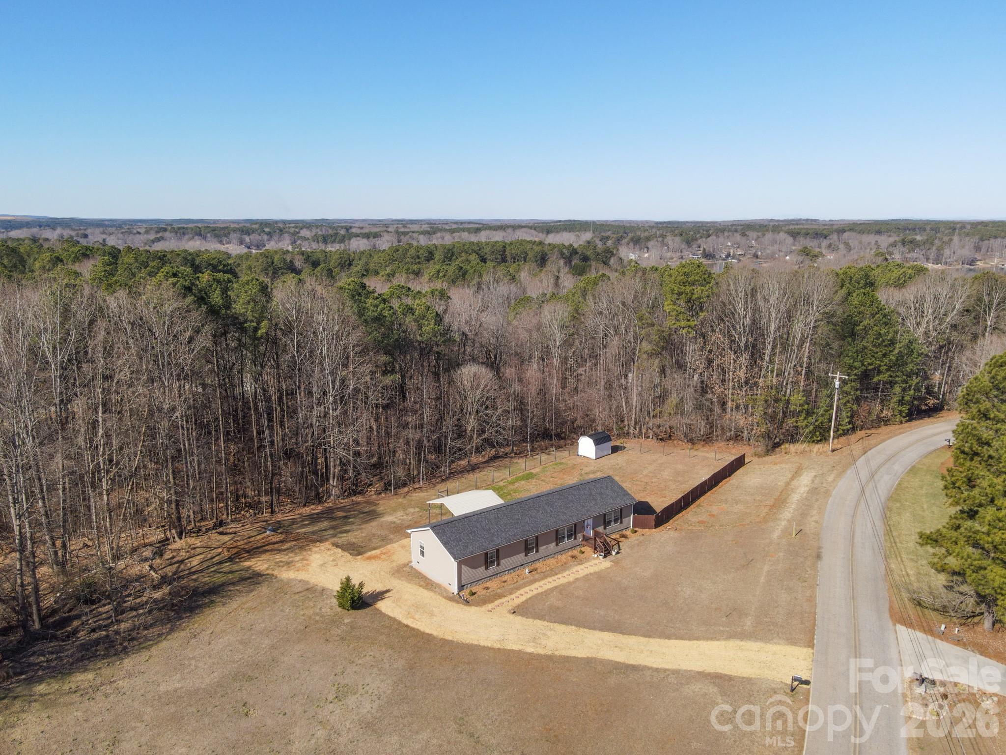 119 Marietta Road Mooresville, NC 28117 - Photo 35 of 38 an aerial view of a house with a yard and large trees