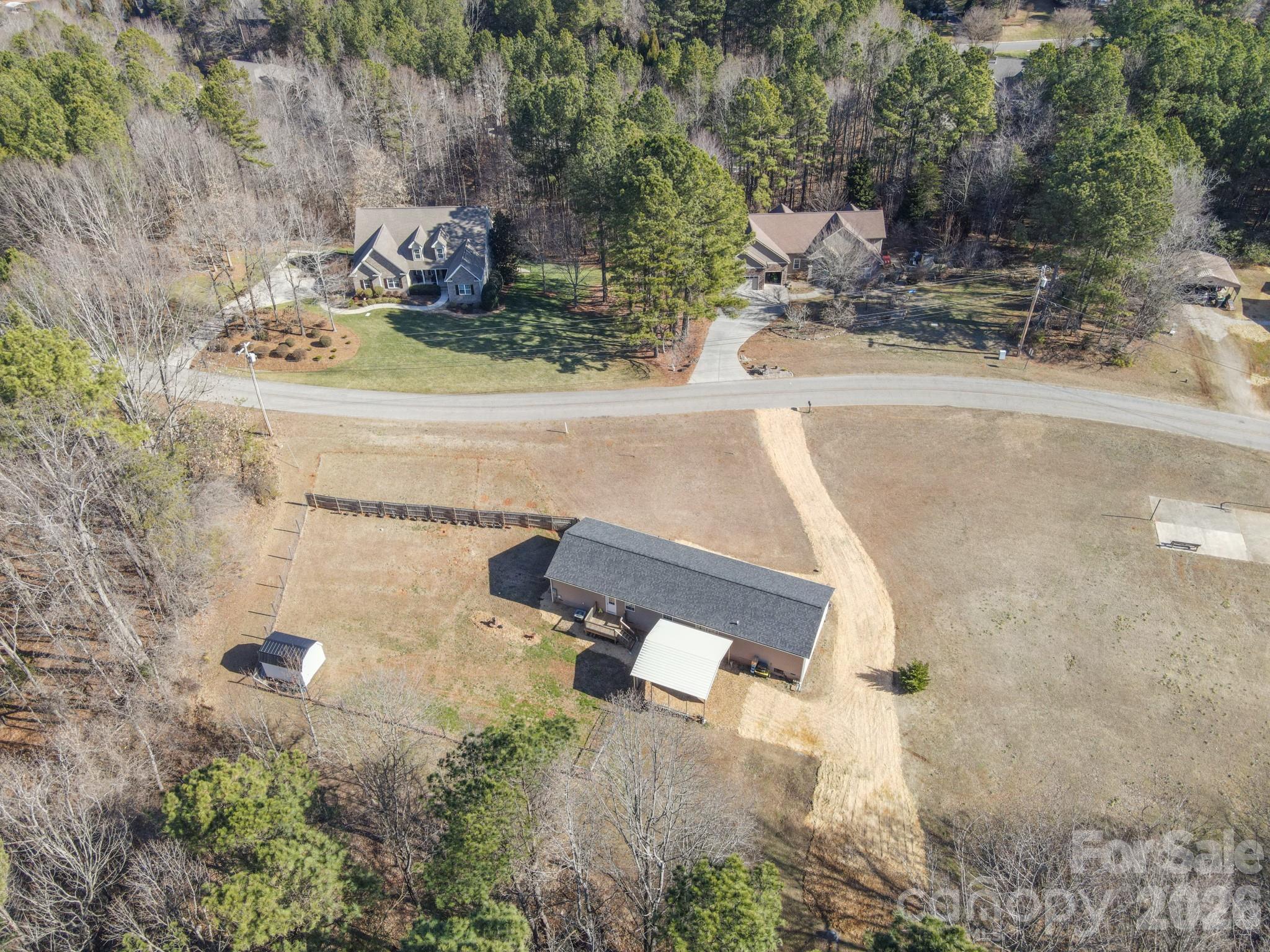 119 Marietta Road Mooresville, NC 28117 - Photo 37 of 38 an aerial view of a house with yard and parking