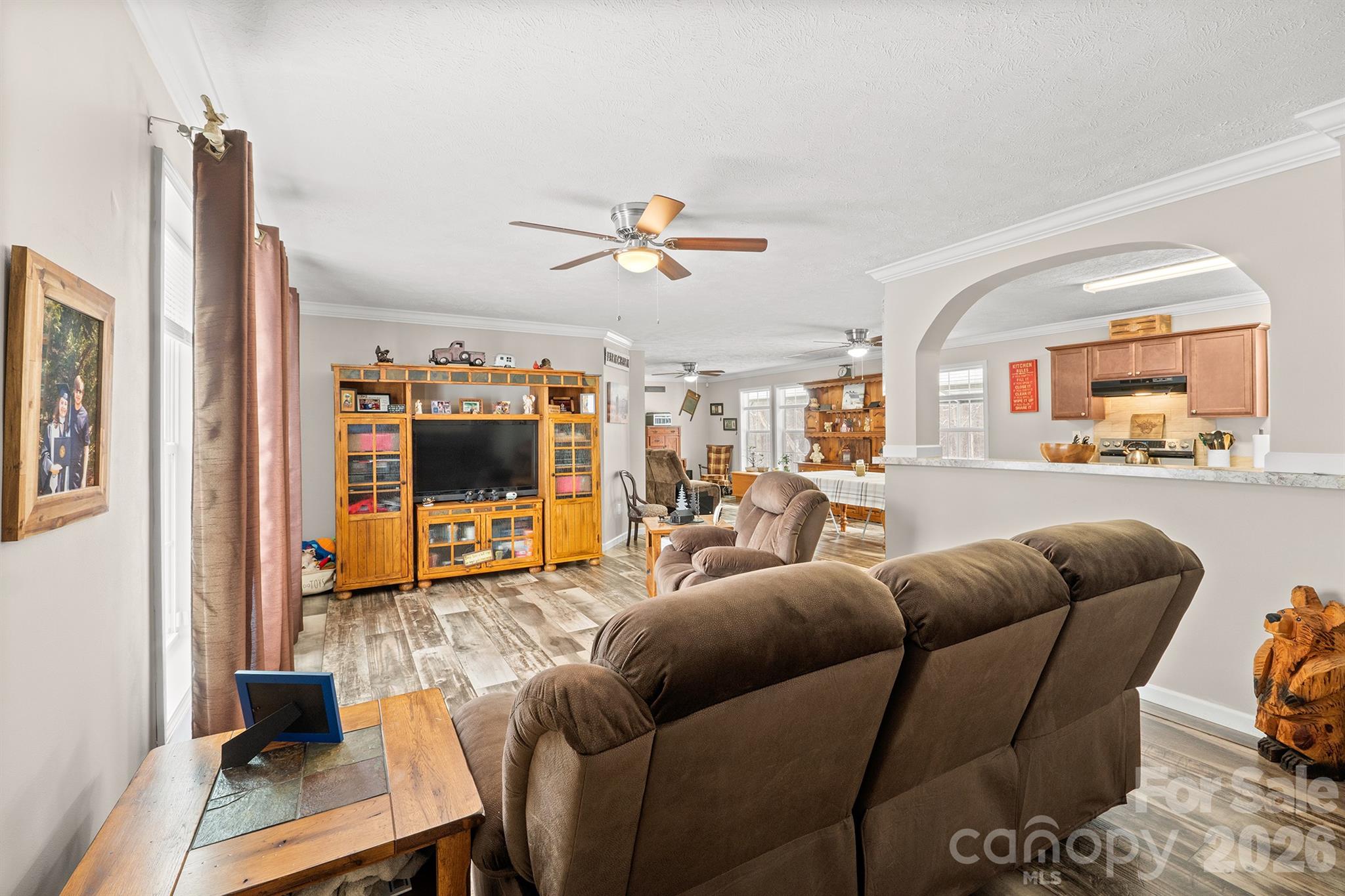 119 Marietta Road Mooresville, NC 28117 - Photo 6 of 38 a living room with furniture and a flat screen tv