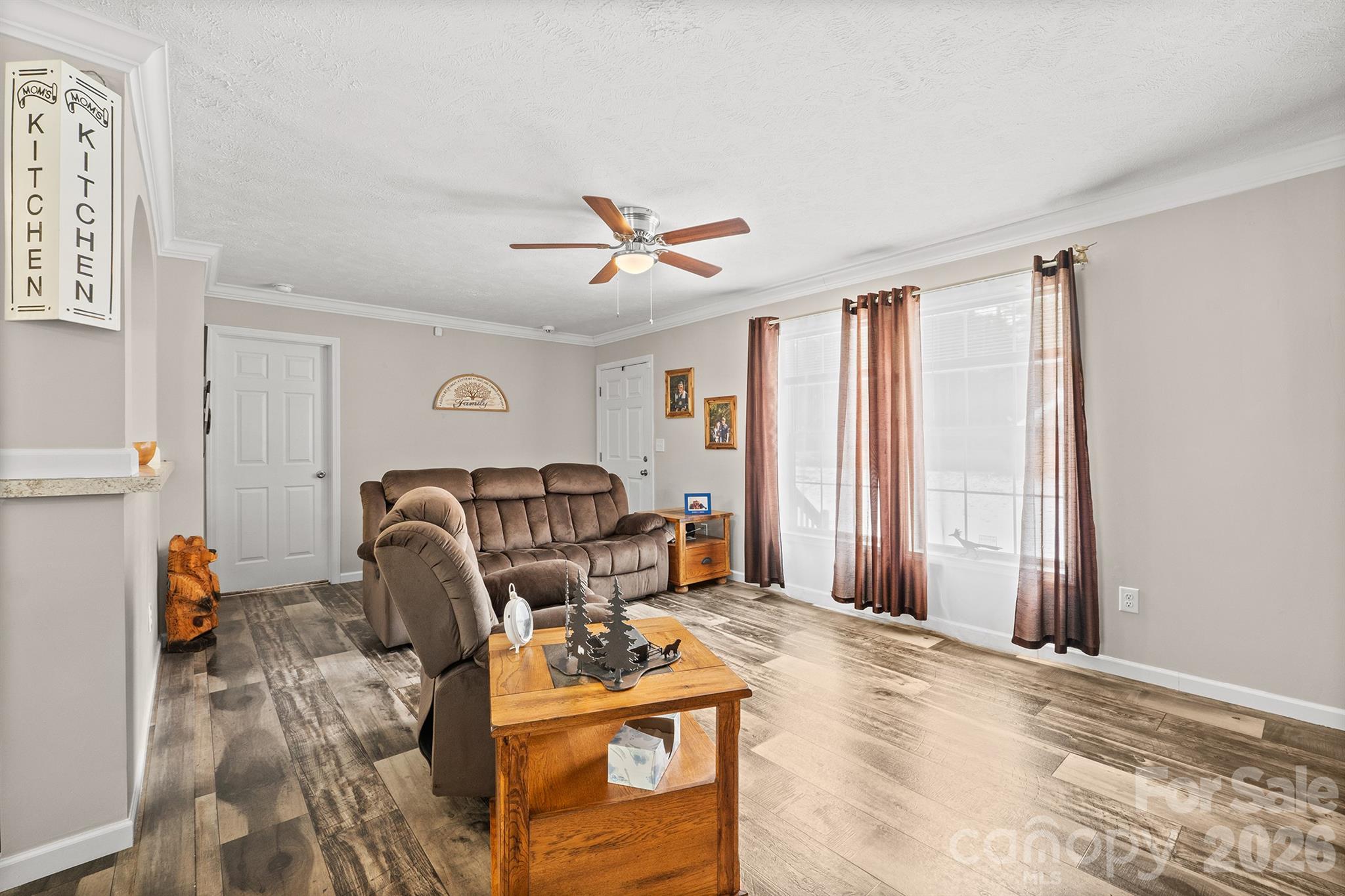 119 Marietta Road Mooresville, NC 28117 - Photo 8 of 38 a living room with furniture a window and a flat screen tv