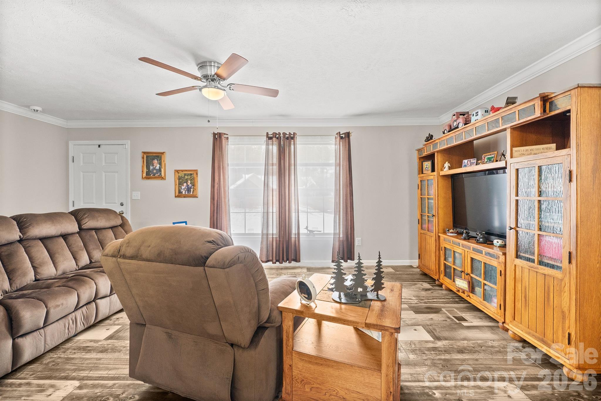 119 Marietta Road Mooresville, NC 28117 - Photo 9 of 38 a living room with furniture and a flat screen tv