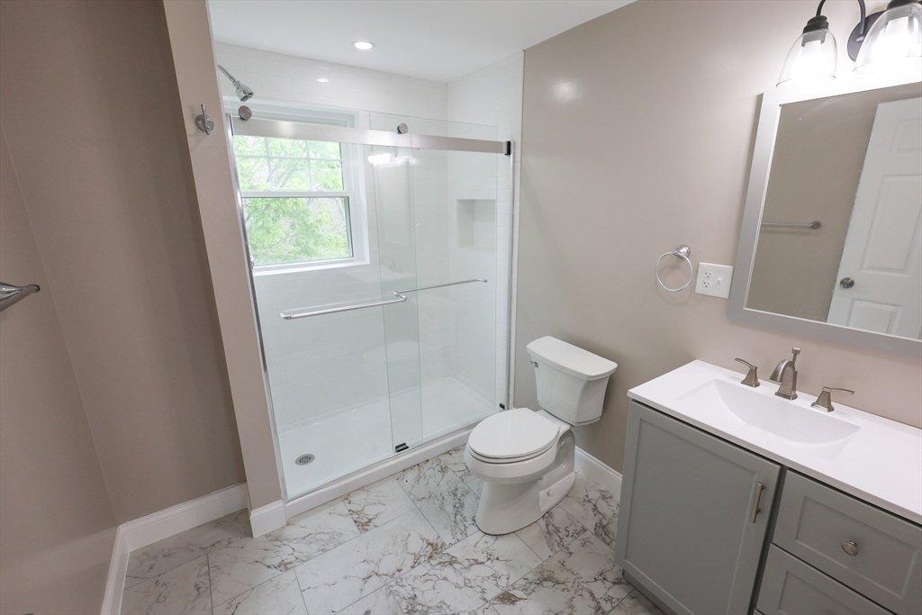 70 Mt Hope Street, Unit 2 Boston, MA 02131 - Photo 14 of 19 a bathroom with a sink toilet and shower