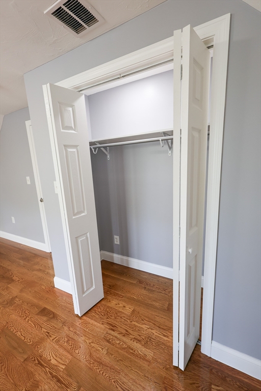 70 Mt Hope Street, Unit 2 Boston, MA 02131 - Photo 18 of 19 a view of walk in closet with empty racks
