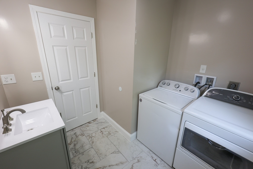 70 Mt Hope Street, Unit 2 Boston, MA 02131 - Photo 10 of 19 a utility room with dryer and washer