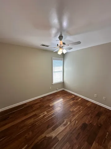 a bathroom with a sink and mirror with toilet