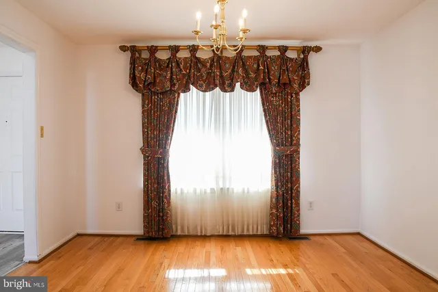 a kitchen with a refrigerator and cabinets
