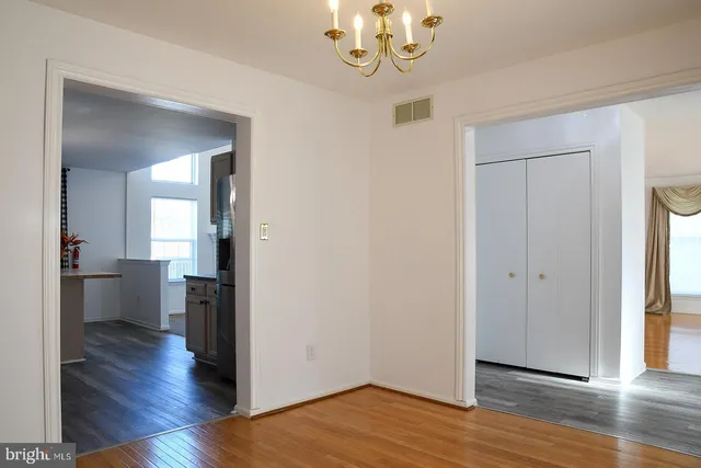 a view of empty room with window and fireplace