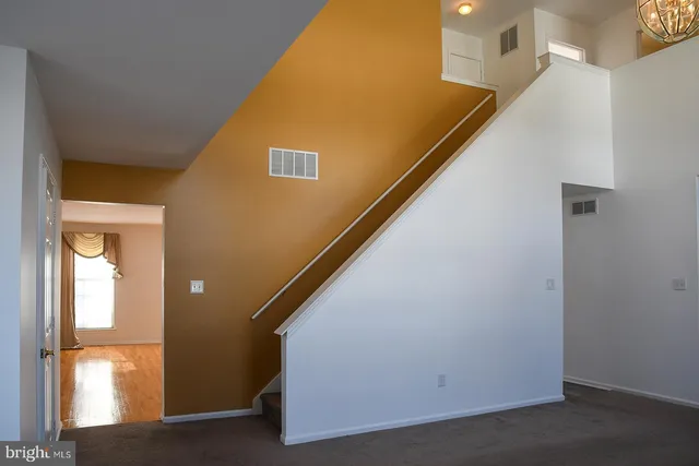 a bathroom with a bathtub and a window