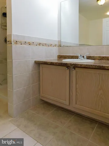 an empty room with wooden floor and fireplace