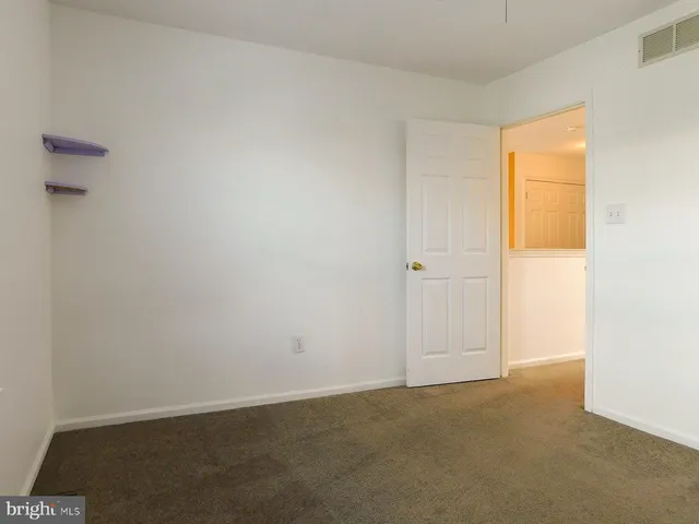 a view of a deck with chair and front door