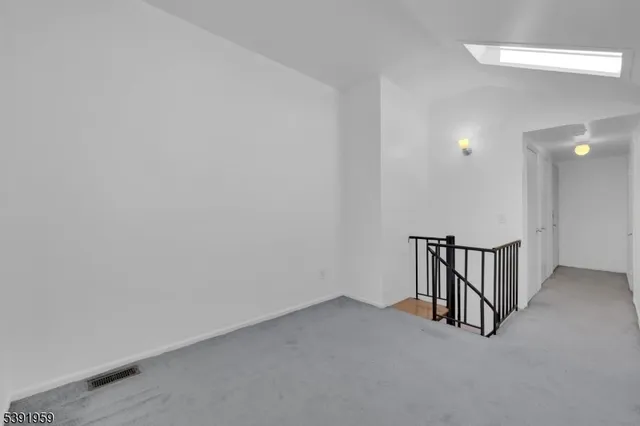 a room with furniture and a potted plant