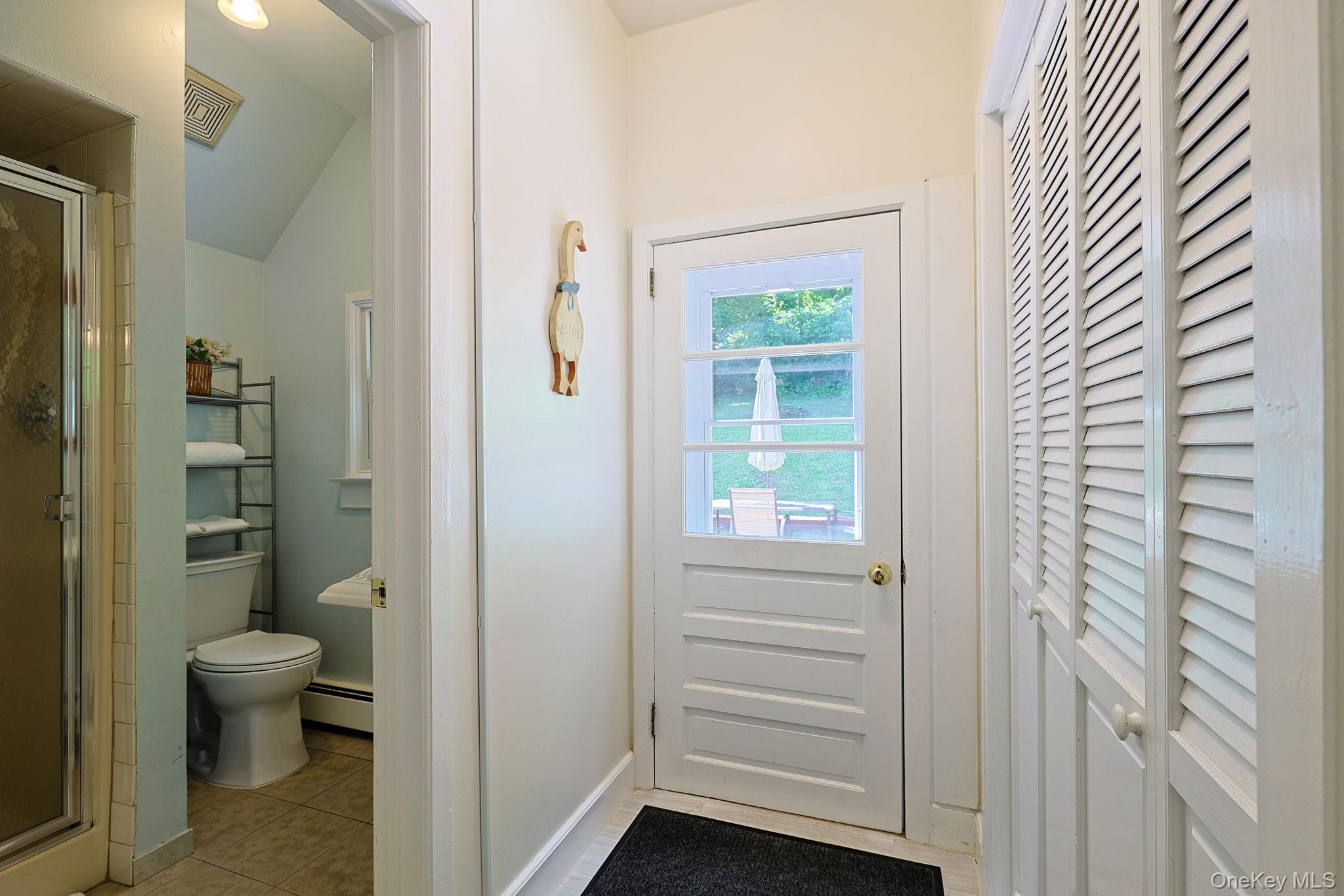 9 Library Road Tuxedo Park, NY 10987 - Photo 26 of 37 First floor full bath off kitchen area and outdoor entry leading to backyard