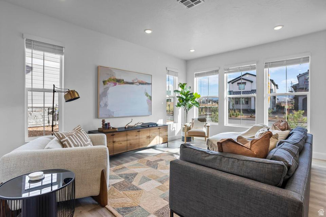 488 West Greenstone Pl Street, Unit 1010 St. George, UT 84790 - Photo 2 of 34 Bright living area featuring abundant natural light from multiple windows