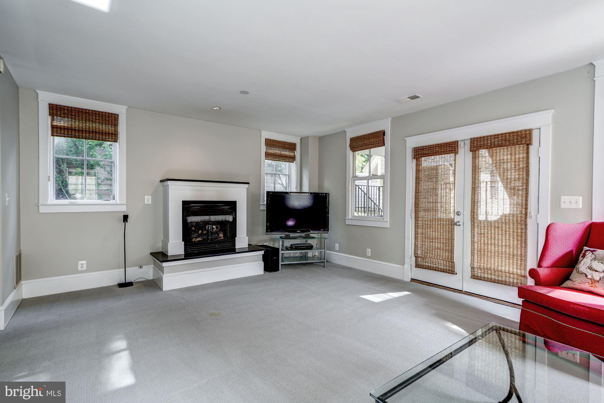 3706 6th Road North Arlington, VA 22203 - Photo 33 of 36 Basement with fireplace and open to backyard patio