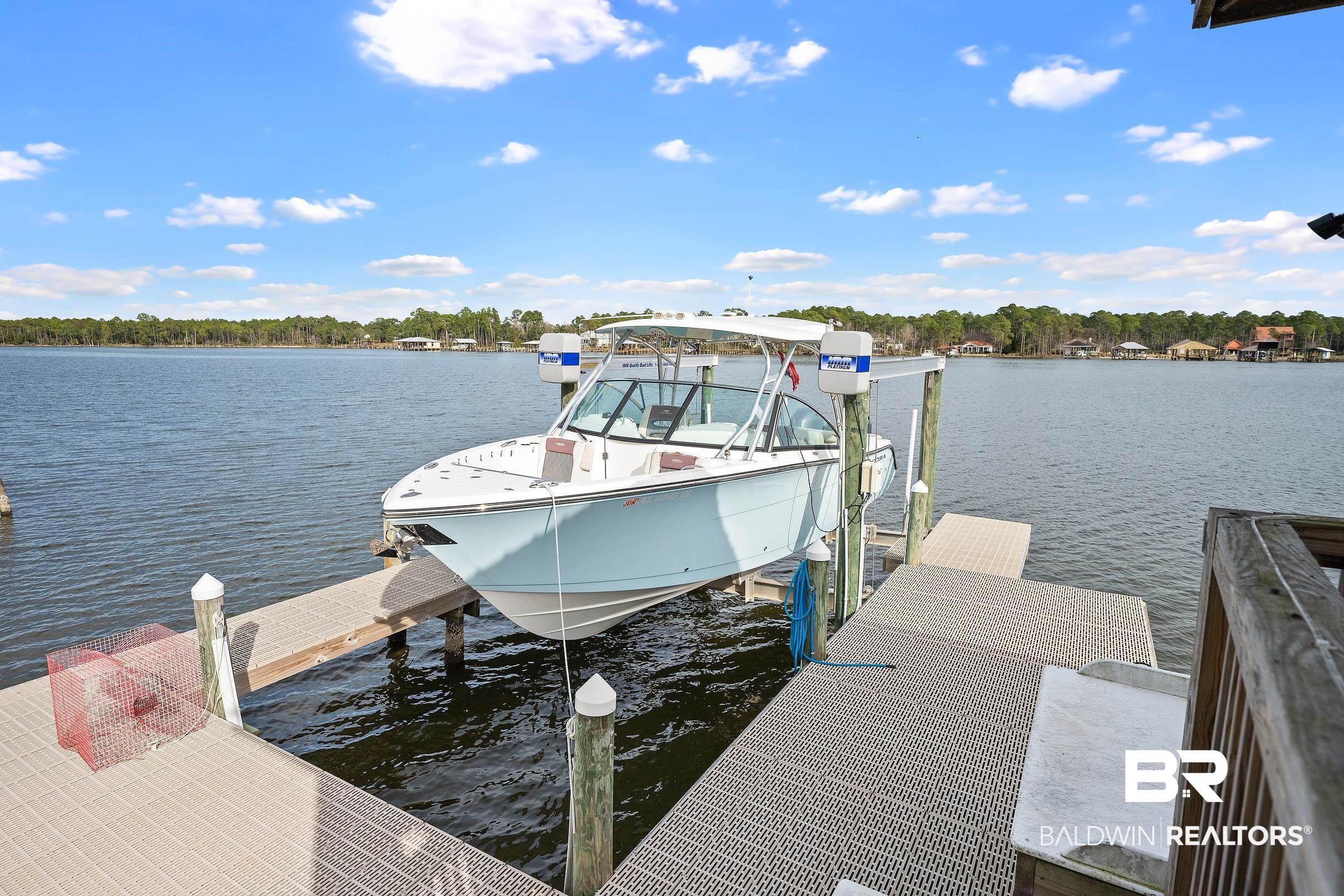 8490 Bay View Drive Foley, AL 36535 - Photo 9 of 67 Dock with boat lift and a water view