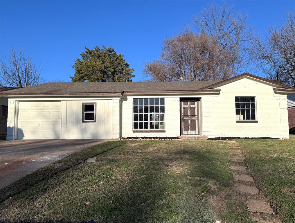 6208 Harmony Lane Dallas, TX 75241 - Photo 1 of 8 a front view of a house with a yard