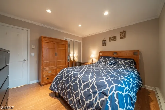 a large bed sitting in a bedroom next to a bathroom