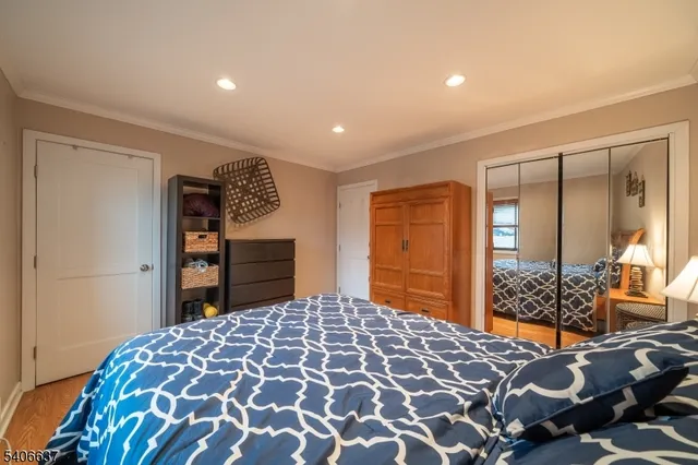 a bedroom with a large bed and a closet