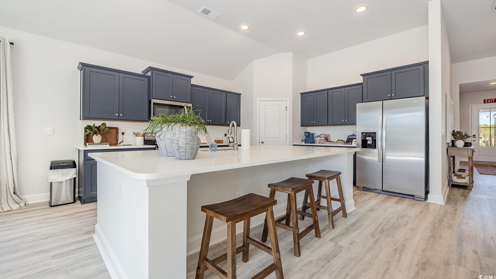 526 Haven View Way Murrells Inlet, SC 29576 - Photo 11 of 31 Dining area featuring lofted ceiling and light har