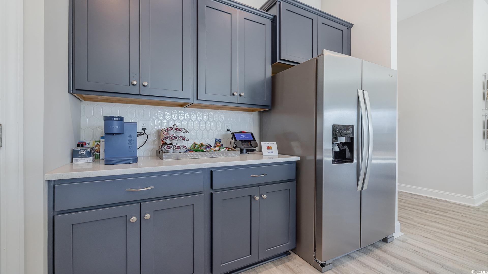 526 Haven View Way Murrells Inlet, SC 29576 - Photo 12 of 31 Kitchen featuring a center island with sink, light
