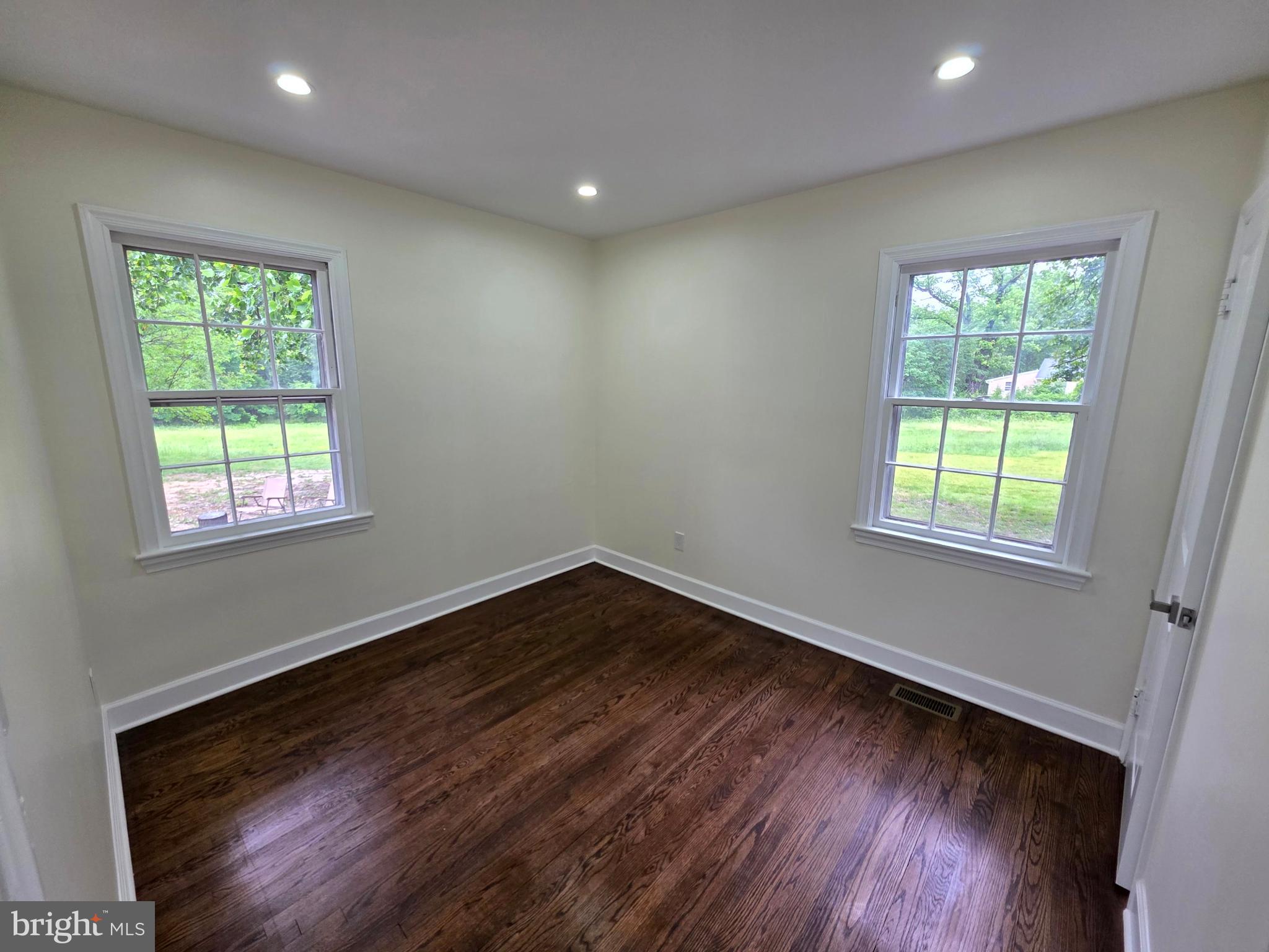 2206 Brinkley Road Fort Washington, MD 20744 - Photo 54 of 78 a view of an empty room with wooden floor and a window