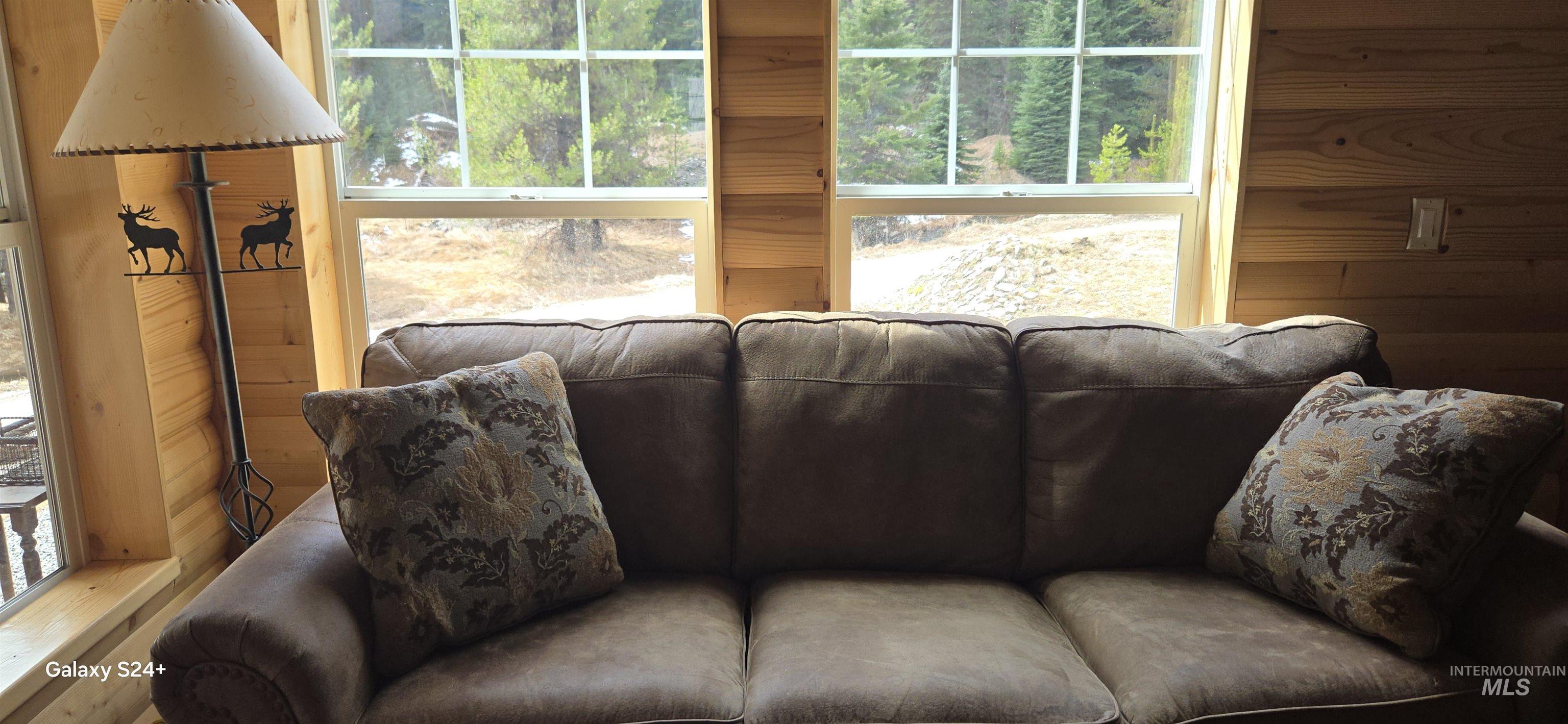 4250 American River Road Elk City, ID 83525 - Photo 14 of 28 Living area featuring wooden walls