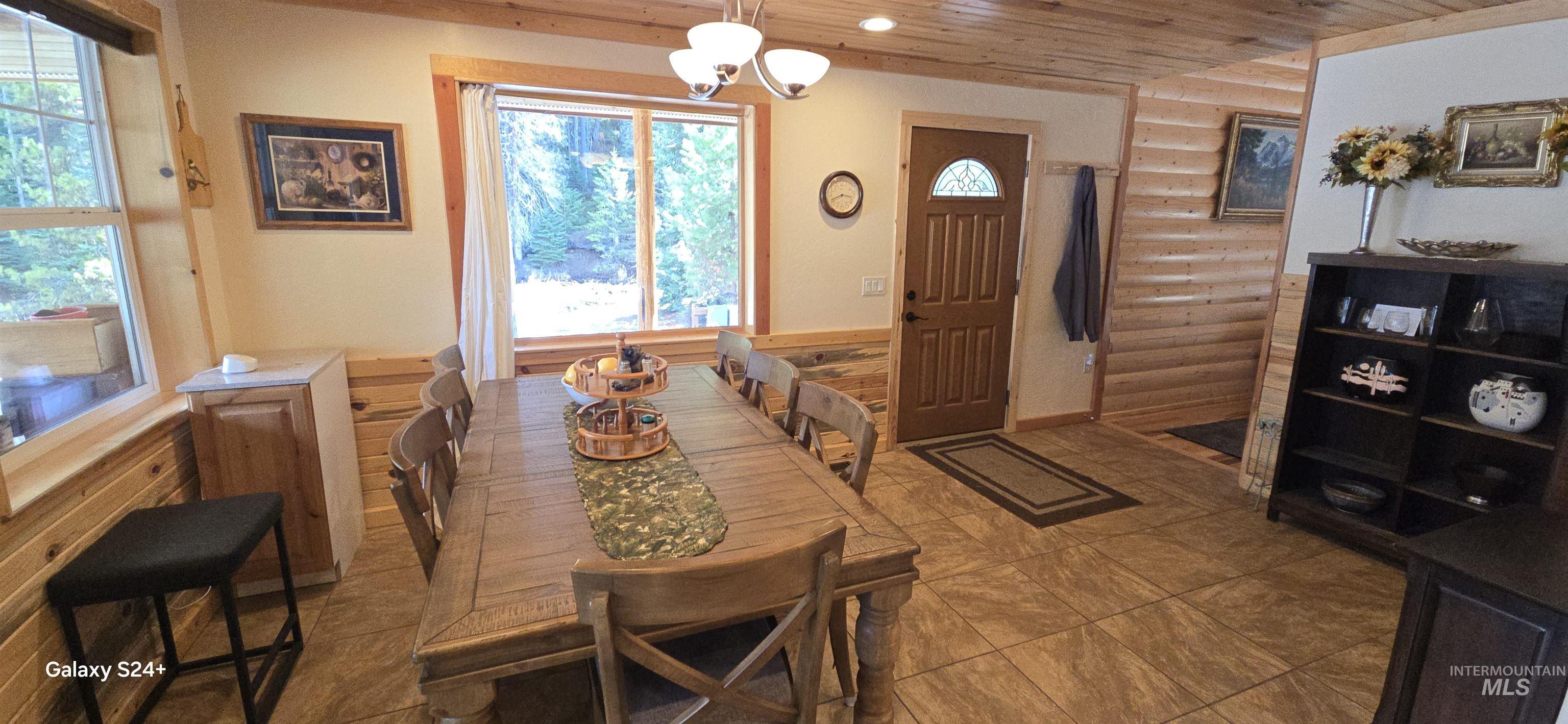 4250 American River Road Elk City, ID 83525 - Photo 18 of 28 Dining room with wooden ceiling and hanging lights