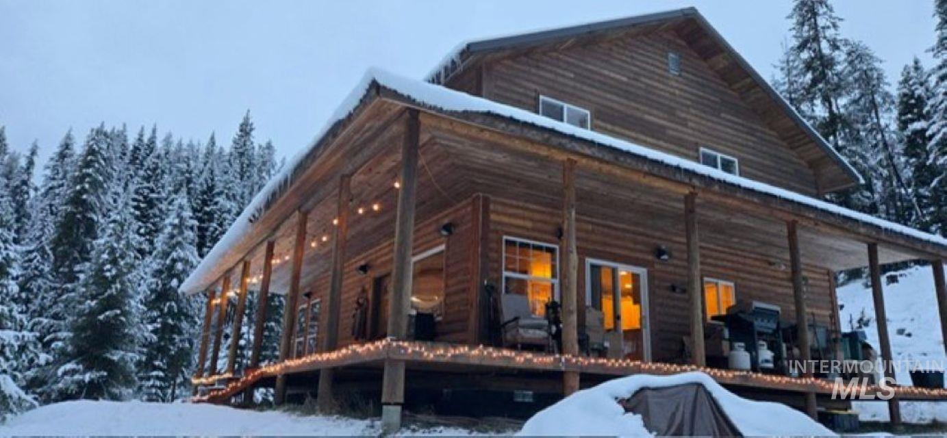 4250 American River Road Elk City, ID 83525 - Photo 4 of 28 Snow covered property with covered porch