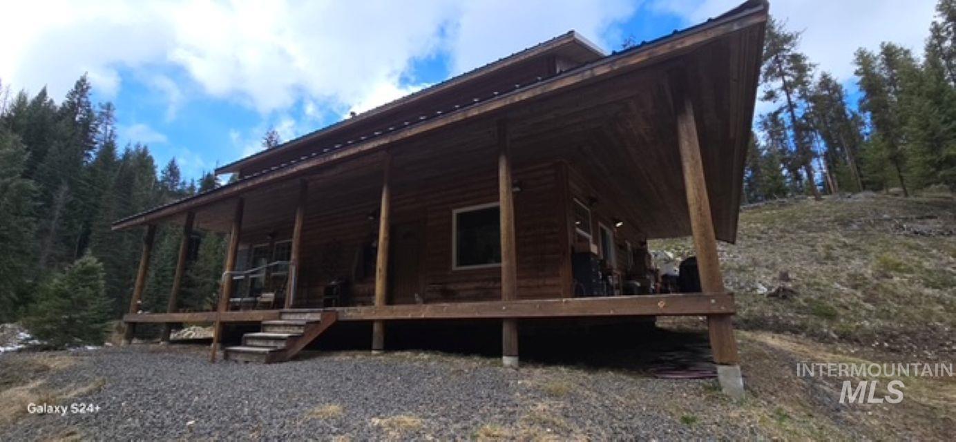 4250 American River Road Elk City, ID 83525 - Photo 7 of 28 View of side of property with a large porch