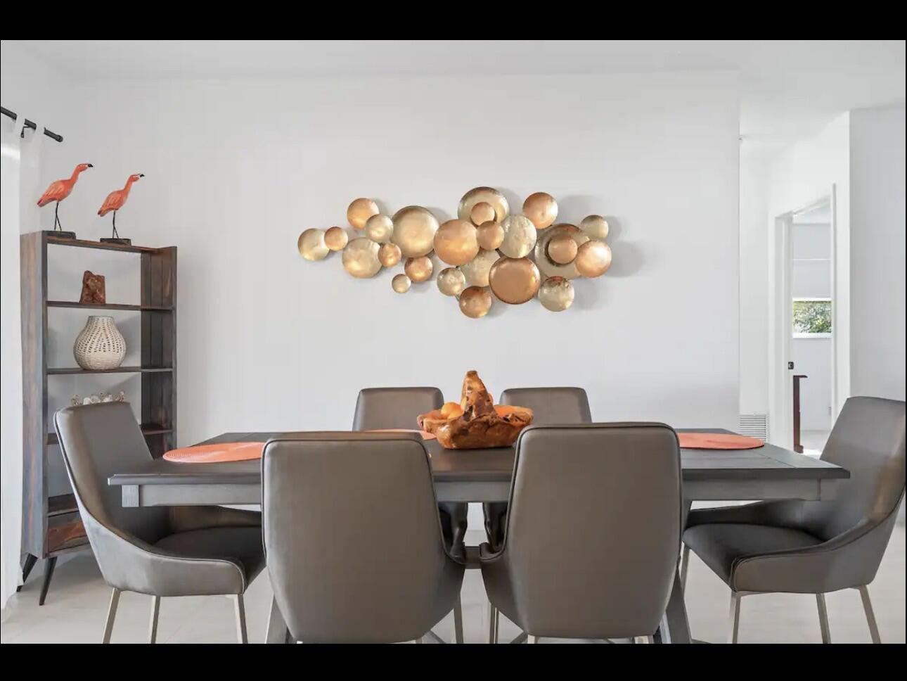 5040 Northeast 22nd Avenue Lighthouse Point, FL 33064 - Photo 14 of 32 a dining room with furniture and wooden floor
