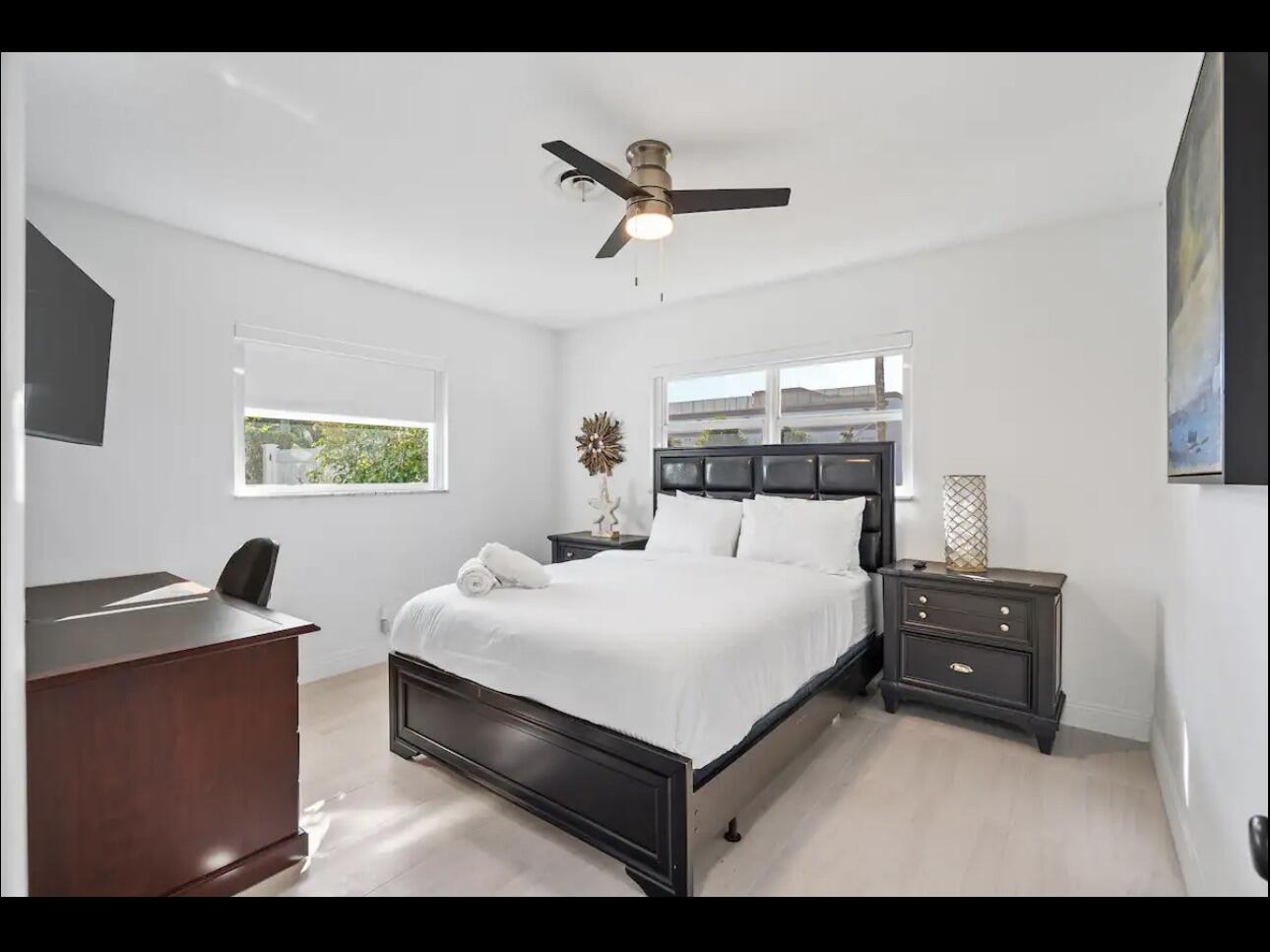 5040 Northeast 22nd Avenue Lighthouse Point, FL 33064 - Photo 19 of 32 a bedroom with a bed and a window