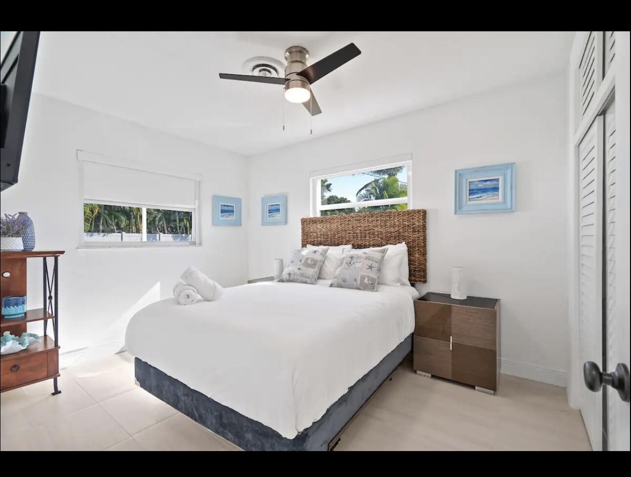 5040 Northeast 22nd Avenue Lighthouse Point, FL 33064 - Photo 20 of 32 a bedroom with a bed and a dresser