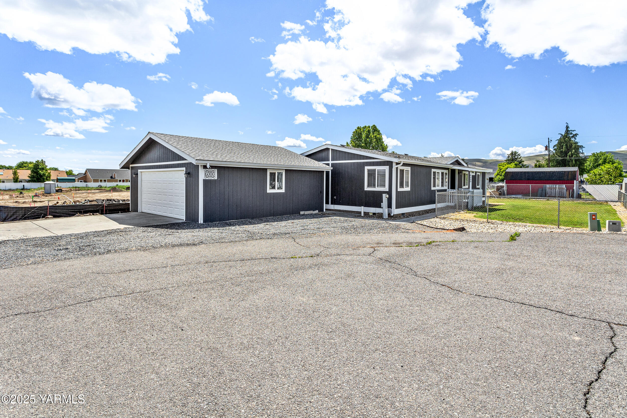 a view of house with a yard