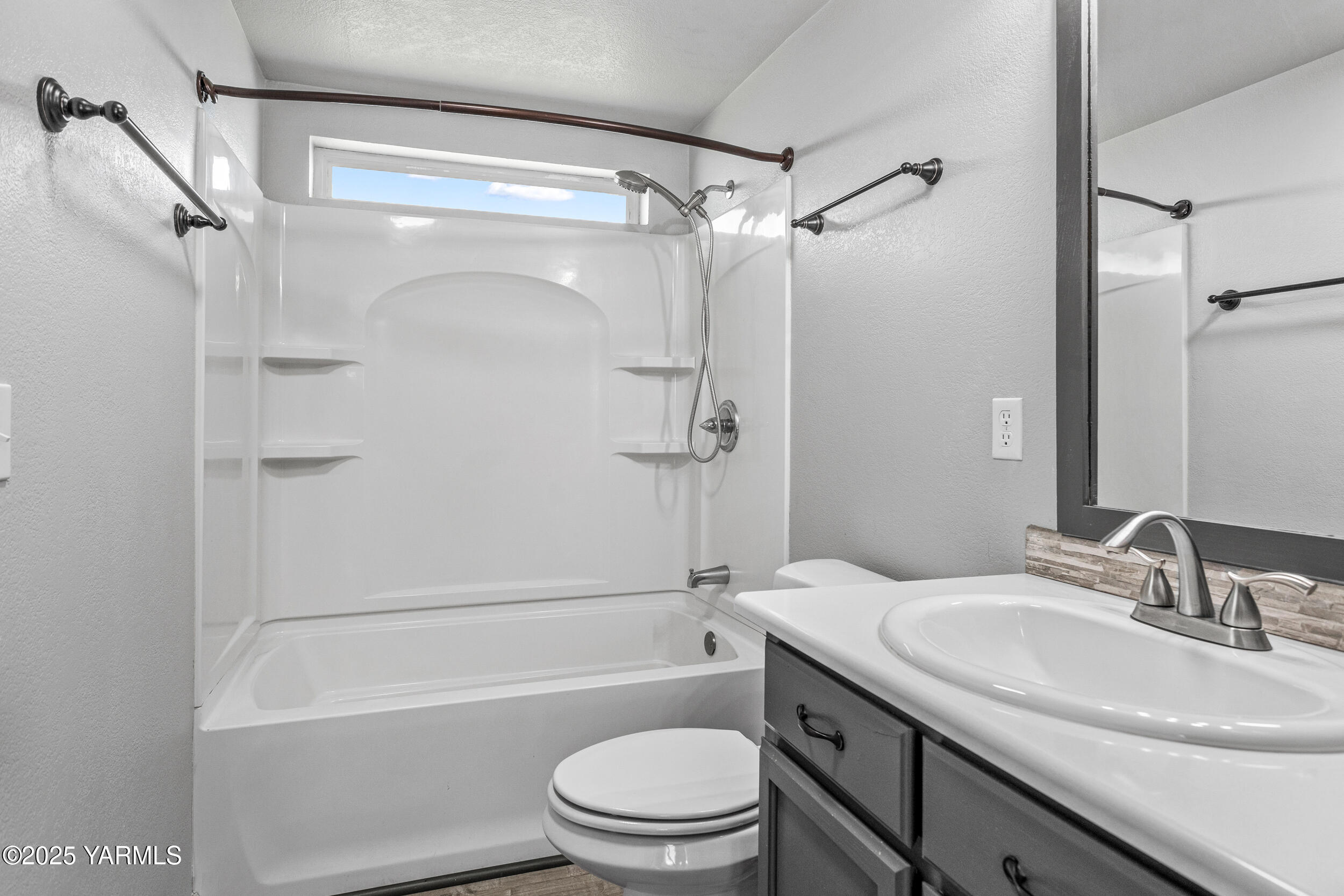 6000 Crestfields Road Yakima, WA 98903 - Photo 12 of 16 a bathroom with a granite countertop sink toilet and shower