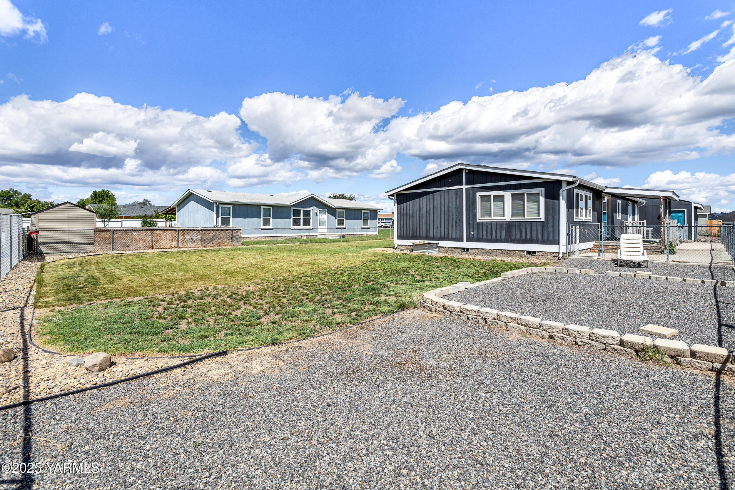6000 Crestfields Road Yakima, WA 98903 - Photo 14 of 16 a front view of a house with a yard