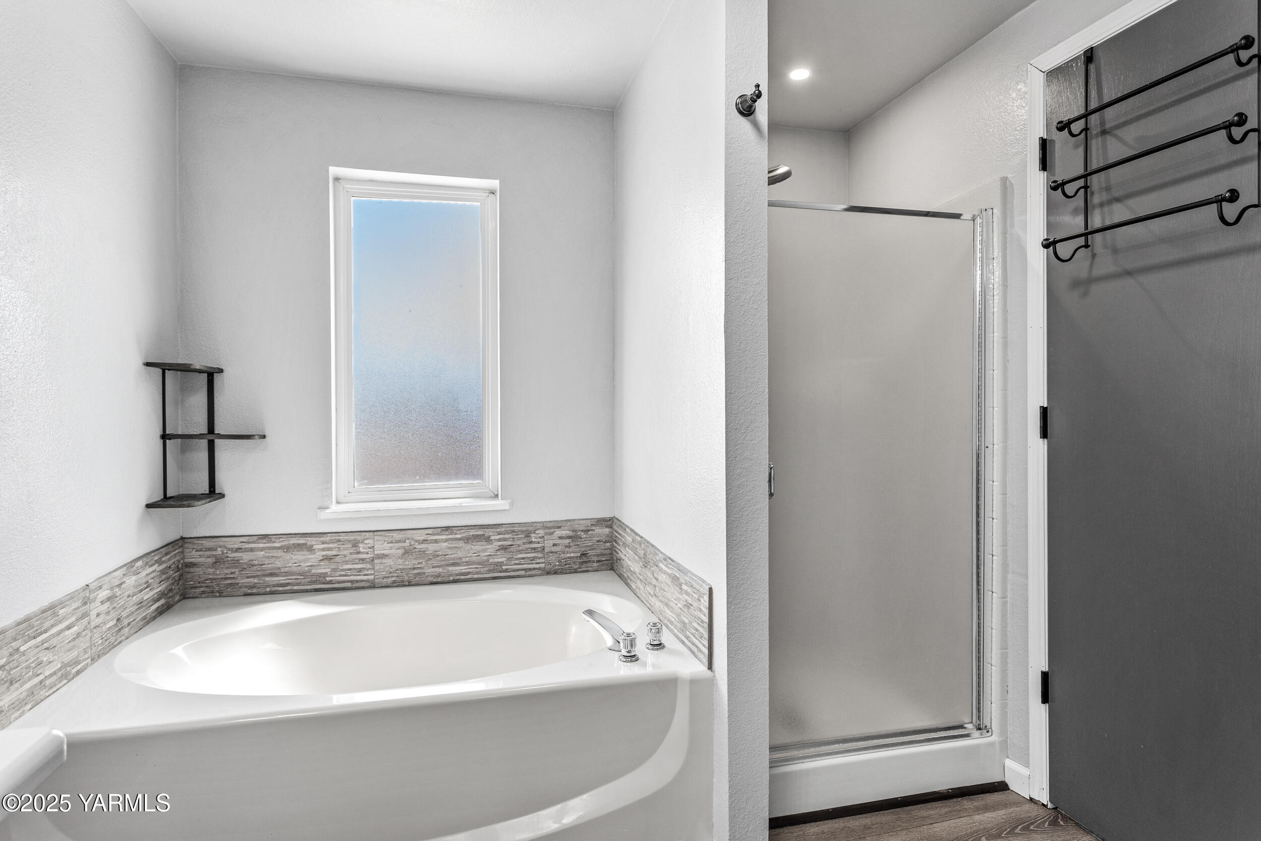 6000 Crestfields Road Yakima, WA 98903 - Photo 7 of 16 a bathroom with a bathtub and a shower